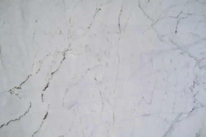 a close up of a white marble surface